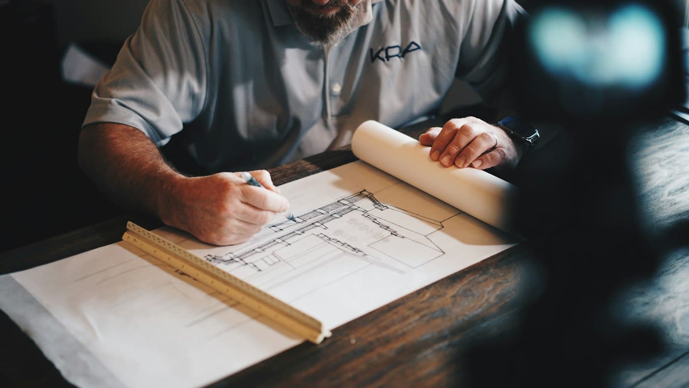 Design drawings and models on a consultant's desk